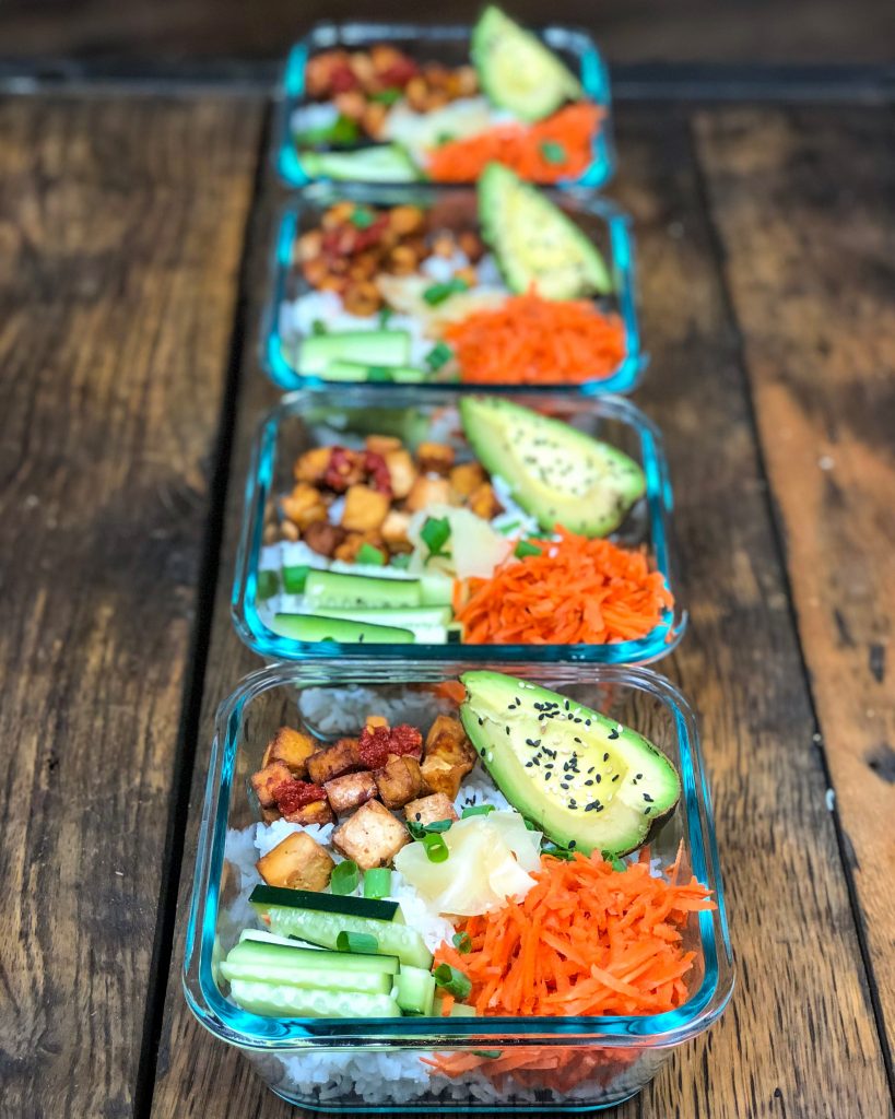 vegan sushi bowls in meal prep containers for lunch