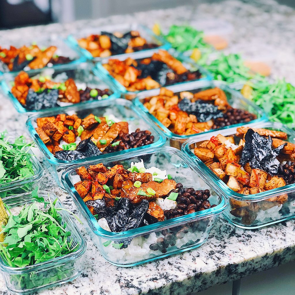 rice bowls with tempeh, roasted potatoes, nori, black beans, arugula, and pickles