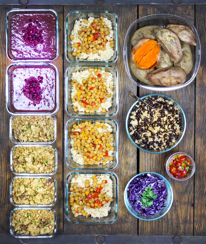 meal prep monday vegan acai bowls with granola, kung poa chickpeas with veggies over brown rice in meal prep containers, burrito stuffed baked potatoes