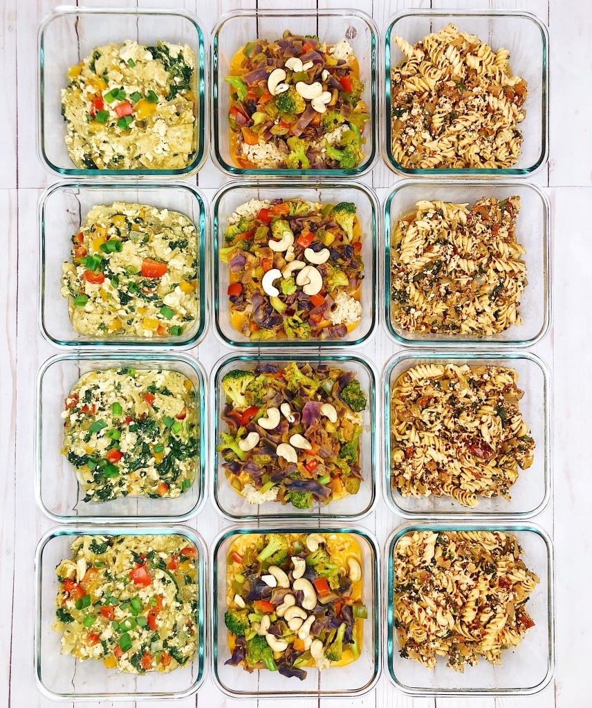 Meal Prep with Tofu Chilaquiles, Yellow Thai Curry, and Chili Mac and Cheese in glass meal prep containers